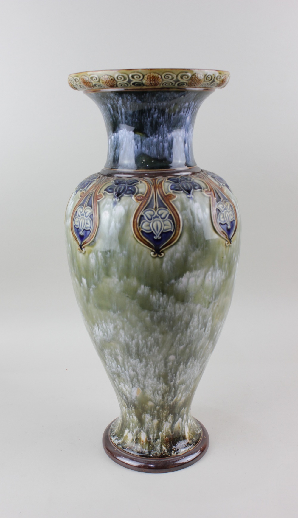 A large Royal Doulton glazed stoneware baluster vase by Louisa Wakely, with tube lined floral