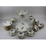 A Limoges 'Royale' porcelain tea service with floral decoration on cream ground comprising tea
