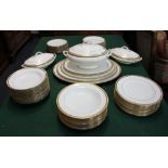 An Aynsley porcelain part dinner service white ground with gilt embellishments, to include a soup