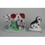 A Staffordshire pottery cow and milkmaid group 16cm high, and a Staffordshire pottery model of a