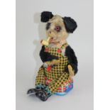 A Japanese ALPS battery operated 'shoe shining' panda smoking a pipe 27cm high (untested)
