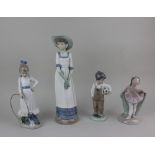 Four Nao porcelain figures of a lady, a ballerina, a girl with puppy and hoop, and a boy holding a