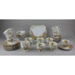 A Royal Albert porcelain part tea service decorated with primroses on white ground, comprising