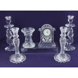 A collection of Waterford crystal comprising two pairs of candlesticks, one modelled with sea