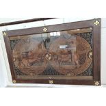 A large Victorian medieval style oak framed textile panel depicting jousting knights within two