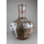 A large Chinese famille rose porcelain bottle vase decorated with panels of figures, birds and