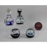 A collection of Caithness Royal Commemorative glass comprising two paperweights and two perfume