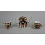 A miniature Royal Crown Derby Imari porcelain part tea service comprising teapot, milk jug and tea