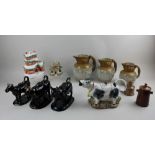 Two Staffordshire pottery cottages, four cow creamers to include one Moorland example, and other