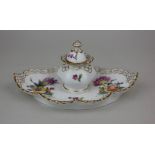 A Royal Copenhagen porcelain inkwell and cover with shaped base, decorated with flowers on white