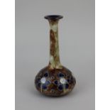 A Royal Doulton glazed stoneware vase with slender neck and tube lined floral decoration on