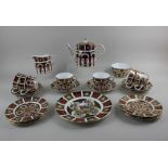 A Royal Crown Derby Imari porcelain part tea service comprising tea pot, milk jug, sugar bowl, six