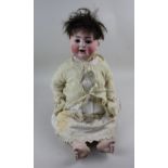 An Alt Beck and Gottschalk German bisque head doll marked 1361 / 55, with sleeping blue eyes and