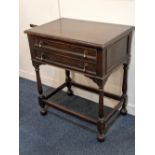 A Maple & Co.early 20th century oak canteen table with two fitted drawers containing a part set of