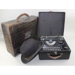 A crocodile skin suitcase marked with owners initials, together with an Underwood typewriter, cased,