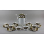 A Susie Cooper 'Keystone Old Gold' pattern porcelain coffee set comprising coffee pot, sugar bowl,