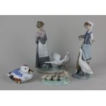 Two Lladro porcelain models of women with geese tallest 25cm high, together with a Nao porcelain