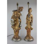 A pair of modern gilt painted table lamps of Chinese figures verso stamped 'Made in Spain' 68cm high