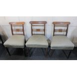 A set of three Victorian dining chairs with tablet bar backs striped upholstered seat on tapered