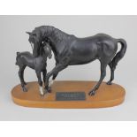 A Beswick Connoisseur model figure group of Black Beauty and Foal mounted on a wooden base 21cm high