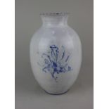 A blue and white glazed pottery baluster vase with floral decoration, marks to base 30cm high (a/f)