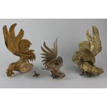 Three gilt metal models of fighting cockerels in various poses (a/f)