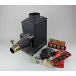 A magic lantern together with a collection of glass slides, various topics to include two boxed -