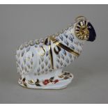 A Royal Crown Derby Imari porcelain paperweight of a ram, with silver stopper