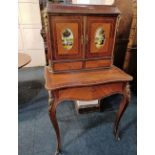 A reproduction gilt metal mounted bureau de dame twin doors with panels of figures, two small