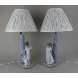 A pair of Nao porcelain figural table lamps 32cm