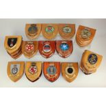 A collection of thirty Royal Navy ship plaques, on wooden mounts, to include HMS Peregrine,