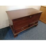 A George III mahogany mule chest with rising top above two base drawers with brass drop handles,