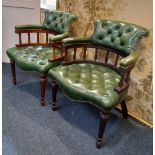 A pair of green button upholstered leather office chairs with balustrade supports on turned