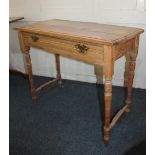 A pine rectangular side table with single drawer on block and turned baluster legs and stretchers,