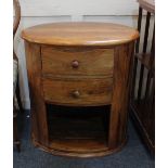 A modern oval side cabinet with two drawers on plinth base, 62cm