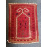 A Persian type prayer rug, red ground with geometric motif 96cm by 72cm