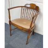 A cane seated elbow chair with slatted and twisted cane back supports