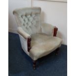 A Victorian button back upholstered nursing chair, on turned front legs and castors