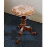A walnut wine table circular top and baluster stem and floral carved tripod base, 38cm