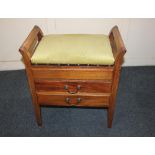 A mahogany piano stool with rising upholstered top and two drawers contianin sheet music, 52cm