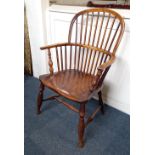 A Windsor armchair on turned baluster supports