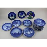 A collection of Edwardian and later Copenhagen porcelain Christmas and commemorative plates, for