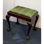 A rectangular upholstered stool with drop in seat on cabriole legs with claw and ball feet, 53cm