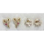 Two pairs of diamond stud earrings, one set with pink sapphires, both stamped '14k', approx gross