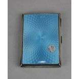 A George V silver cigarette case with blue guilloche enamelled lid and gilt interior Birmingham