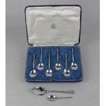A cased set of six George V silver teaspoons with seated lion terminals and pear shaped bowls, maker