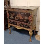 A Chinoiserie black lacquered and gilt decorated chest with hinged rectangular top and front panel