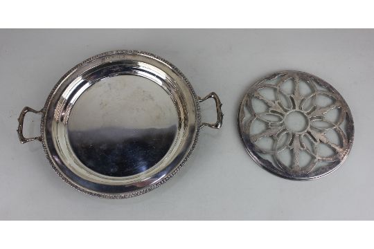 A George V silver two handled circular dish on four scroll feet, Birmingham 1935, maker The Alex