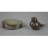 A continental silver bird shaped pounce pot with hinged lid base, 5cm and a mother of pearl oval