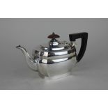 A George V silver teapot of oval form, Birmingham 1928, makers mark worn gross weight 11.3oz